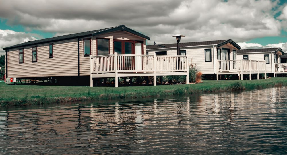 Static caravans next to a lake