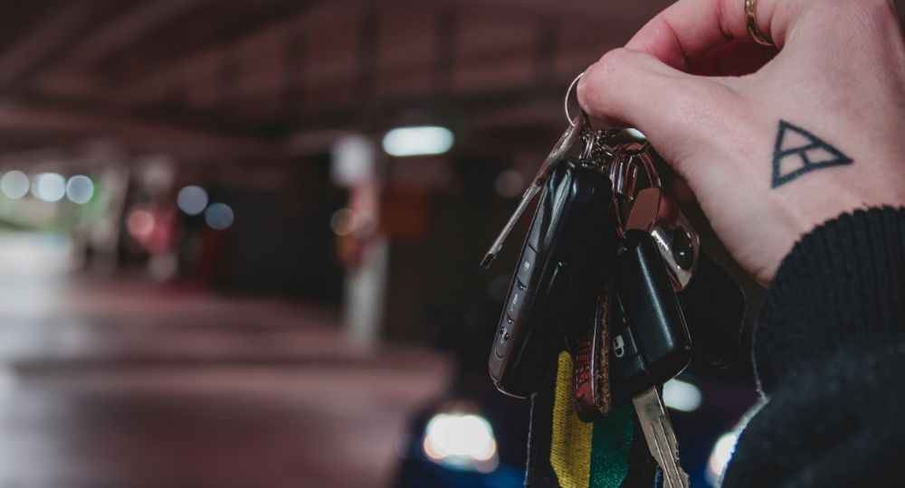 Student holding a bunch of car keys