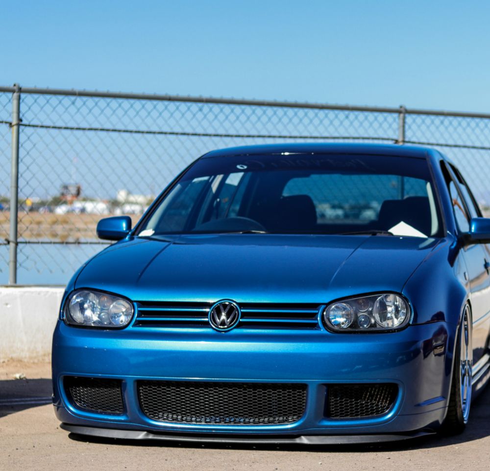 Modified blue golf parked up