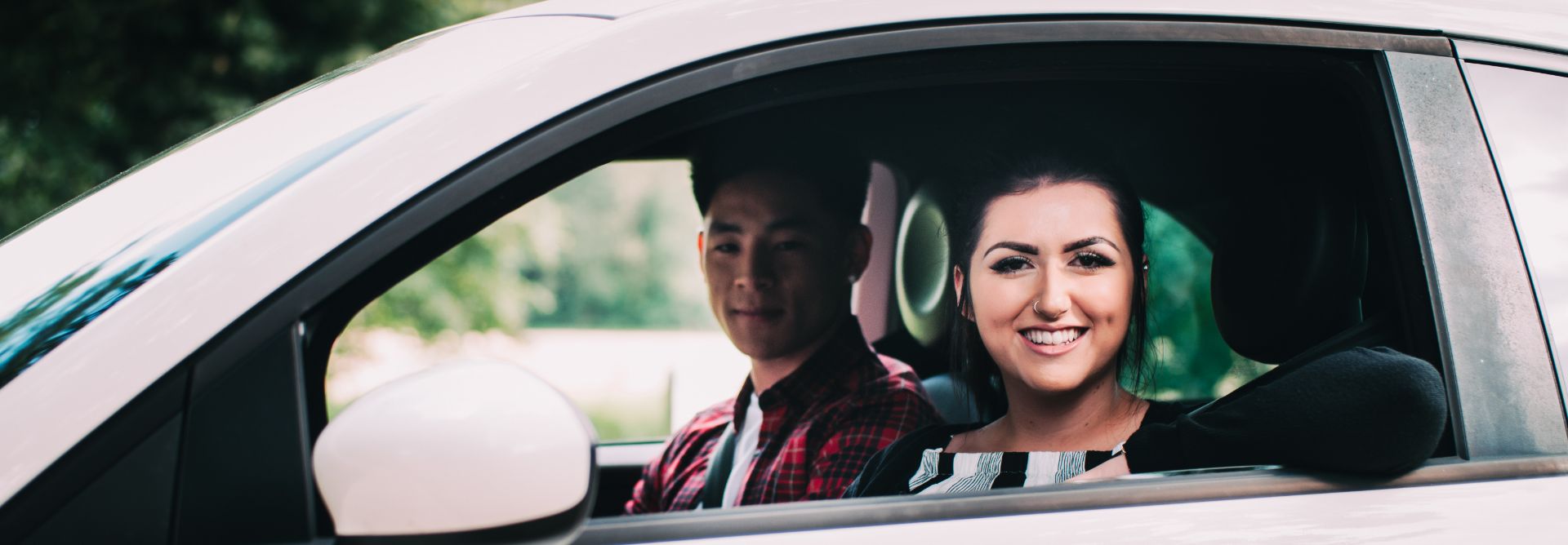 Students in a white fiat 500