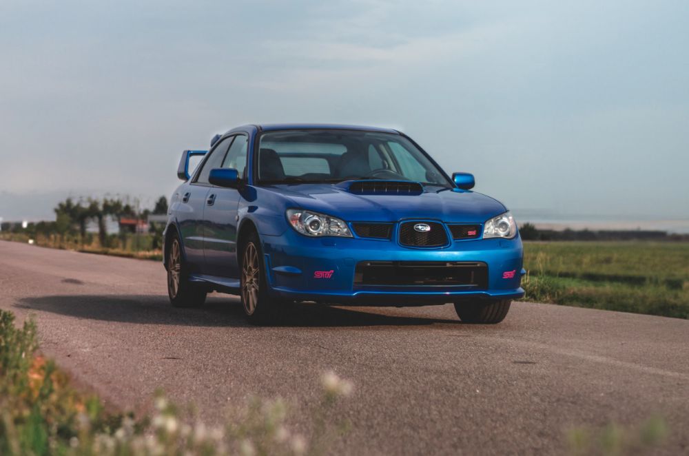 Blue Subaru on the road