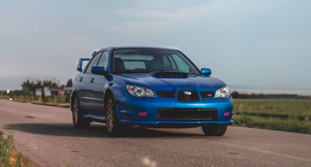 Blue Subaru on the road