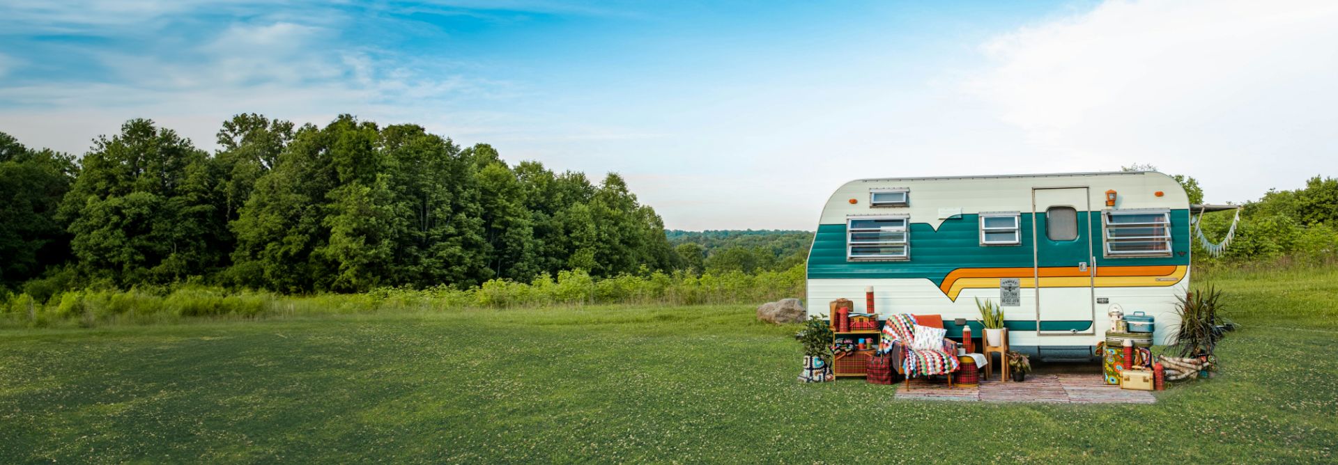Caravan parked in a sunny field