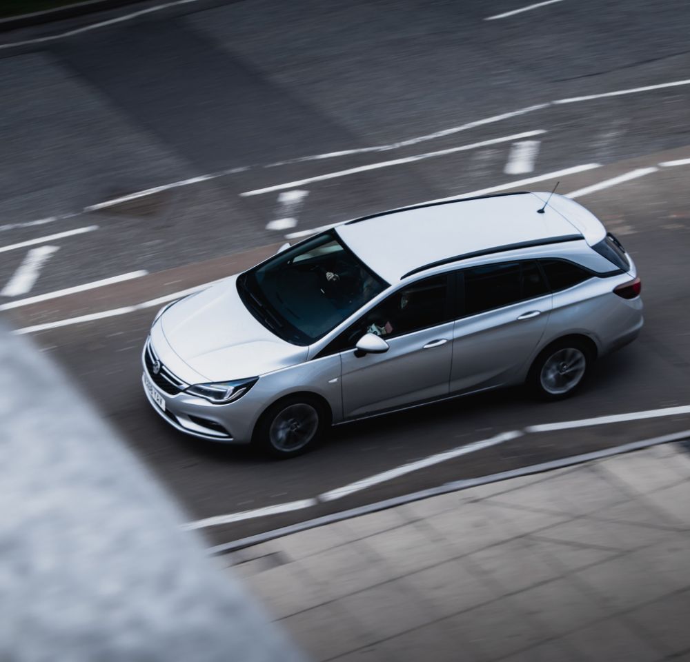 Vauxhall driving down road