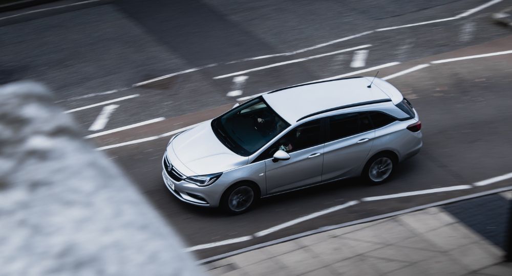 Vauxhall driving down road