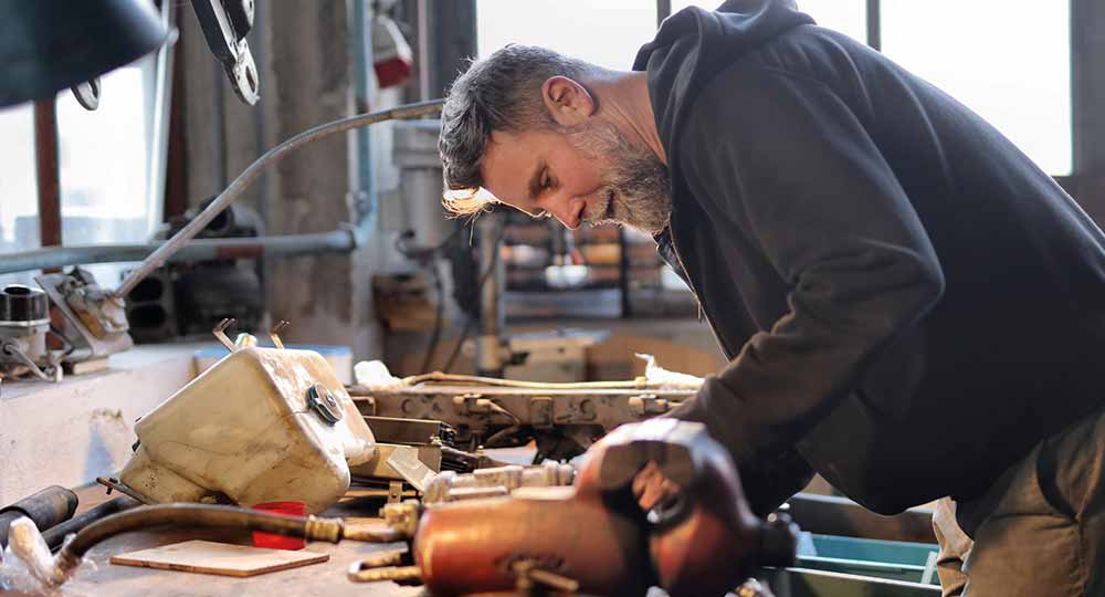 Person working in garage on their Westfield kit car