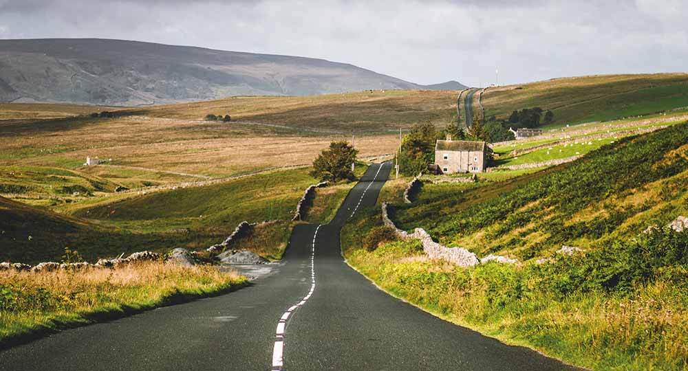 Road running through rolling UK hills – perfect for a Westfield car